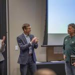 Don Wernholm (right), receives one of the Excellence in Service Awards from Rhea Dever and President Brock Tessman