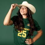 Sami Brown wearing her hat and soccer jersey