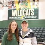 Makaylee Kuhn and Sarah Kuehn in Vandament Arena, home court for NMU volleyball and basketball.