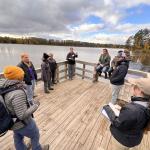 Students lead a "practice tour" along the Dead River