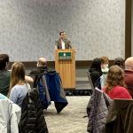 Tessman addressing the large audience of faculty, staff, students and community members in the Northern Center Ballrooms.