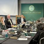President Brock Tessman (back left) participates in his final NMU Board of Trustees meeting.