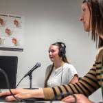 Isaacson (right) and a student in NMU's Speech-Language-Hearing Clinic