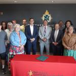 Bay Mills Community College President Duane Bedell is pictured center, between former NMU President Brock Tessman and current Interim President Gavin Leach at the late June signing ceremony on campus, which was also attended by representatives of NMU's Center for Native American Studies and School of Education.